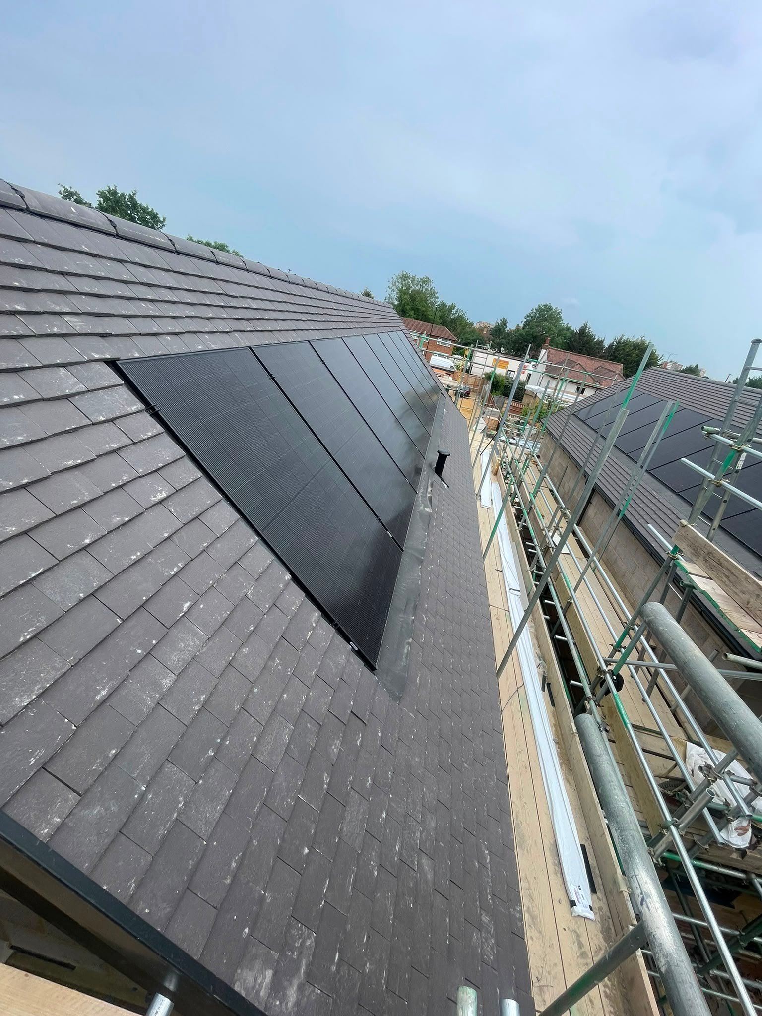 Finished Tiled Roof with Integrated Solar Panels by B KARAN BUILD ROOFING Ltd
